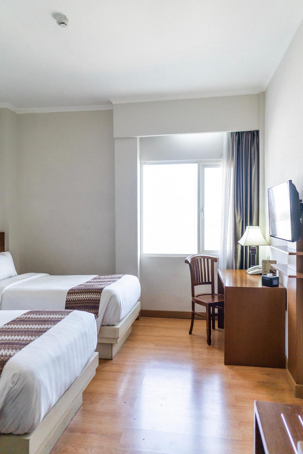 Photo of a hotel room in 'Chez Amina' with two simple bed --- Overnight from 96 euros --- Opinion: 5 stars